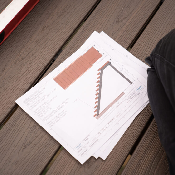 Blueprint set down on a deck floor