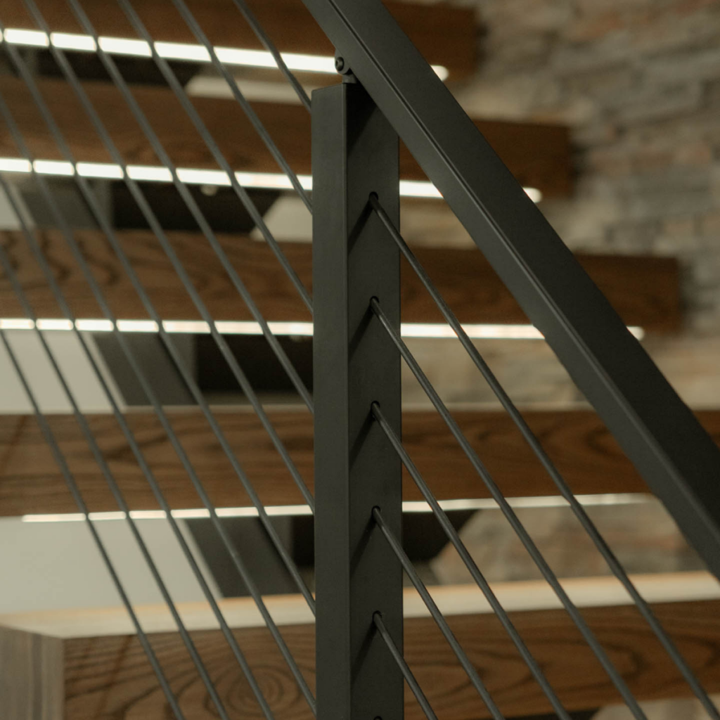 Railing shown in front of treads with integrated LEDs