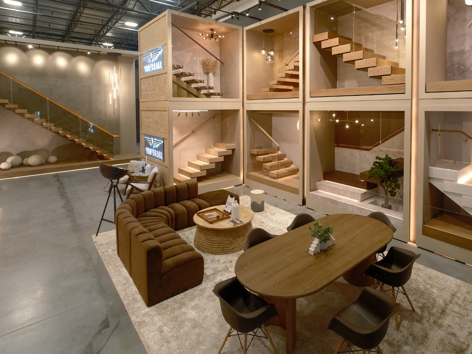 A wide shot of the floor of the Viewrail Design Gallery, featuring a sitting area in front of large product displays.