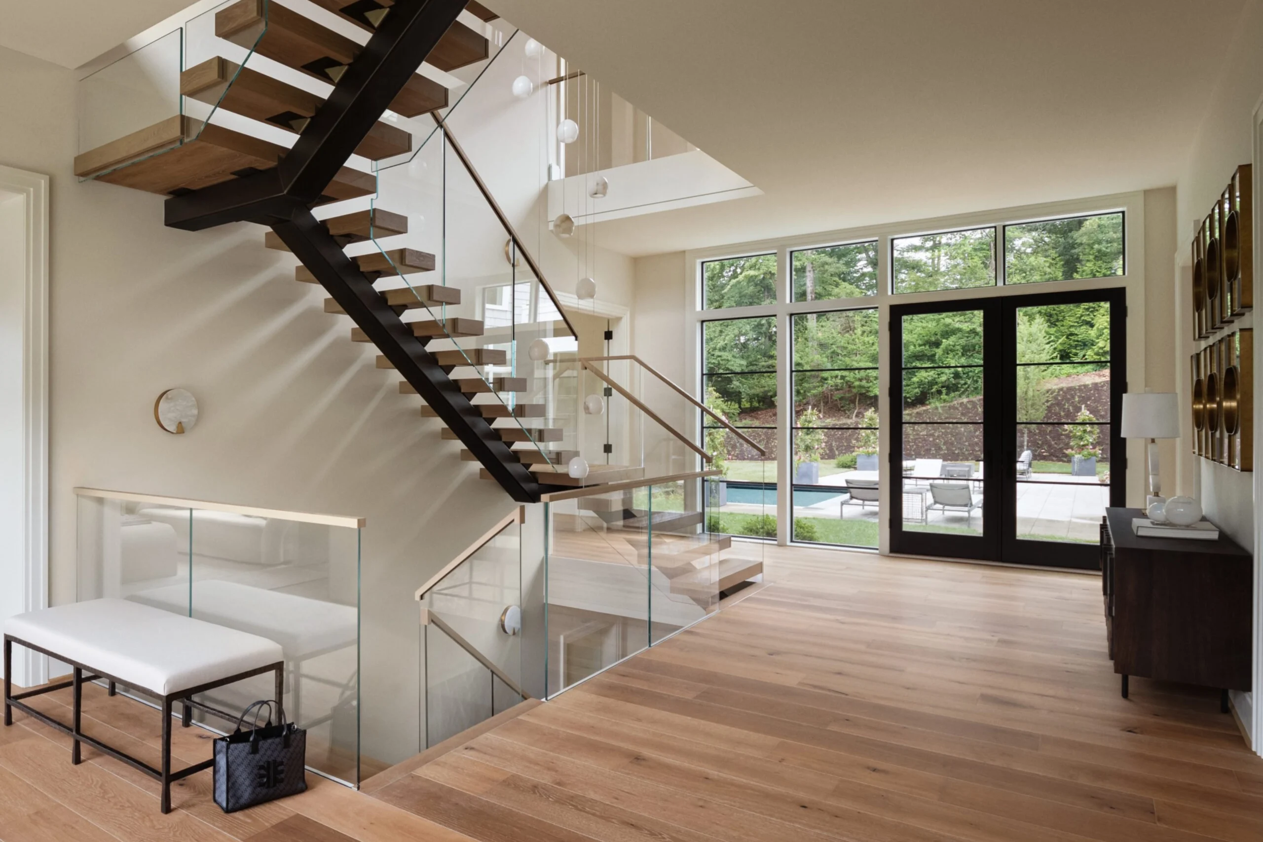 A U-turn FLIGHT Mono with Vedera glass railing sits an large, light-filled home.