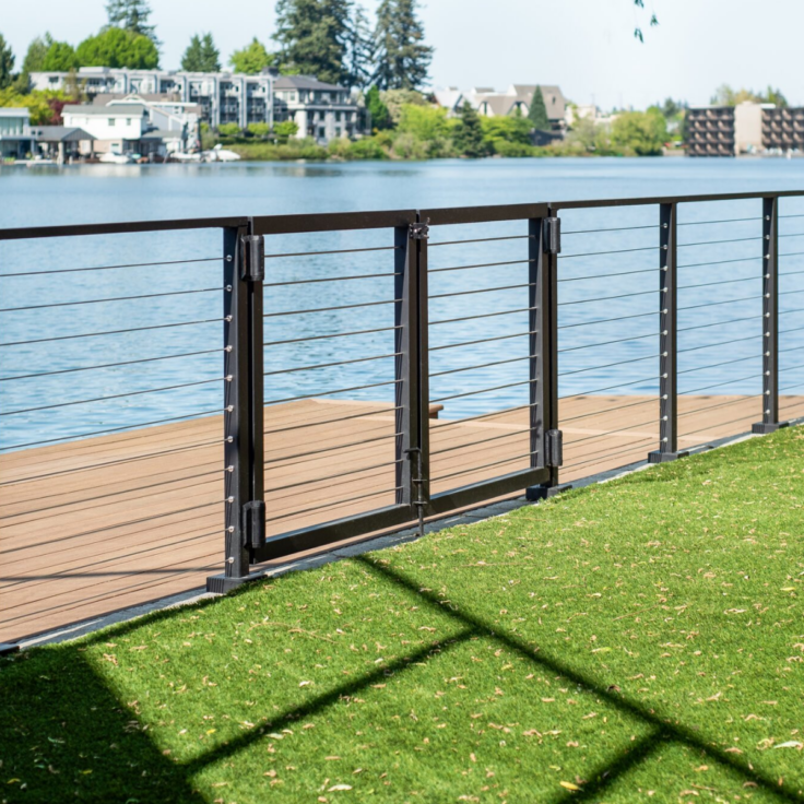 Exterior signature cable railing with a double door gate