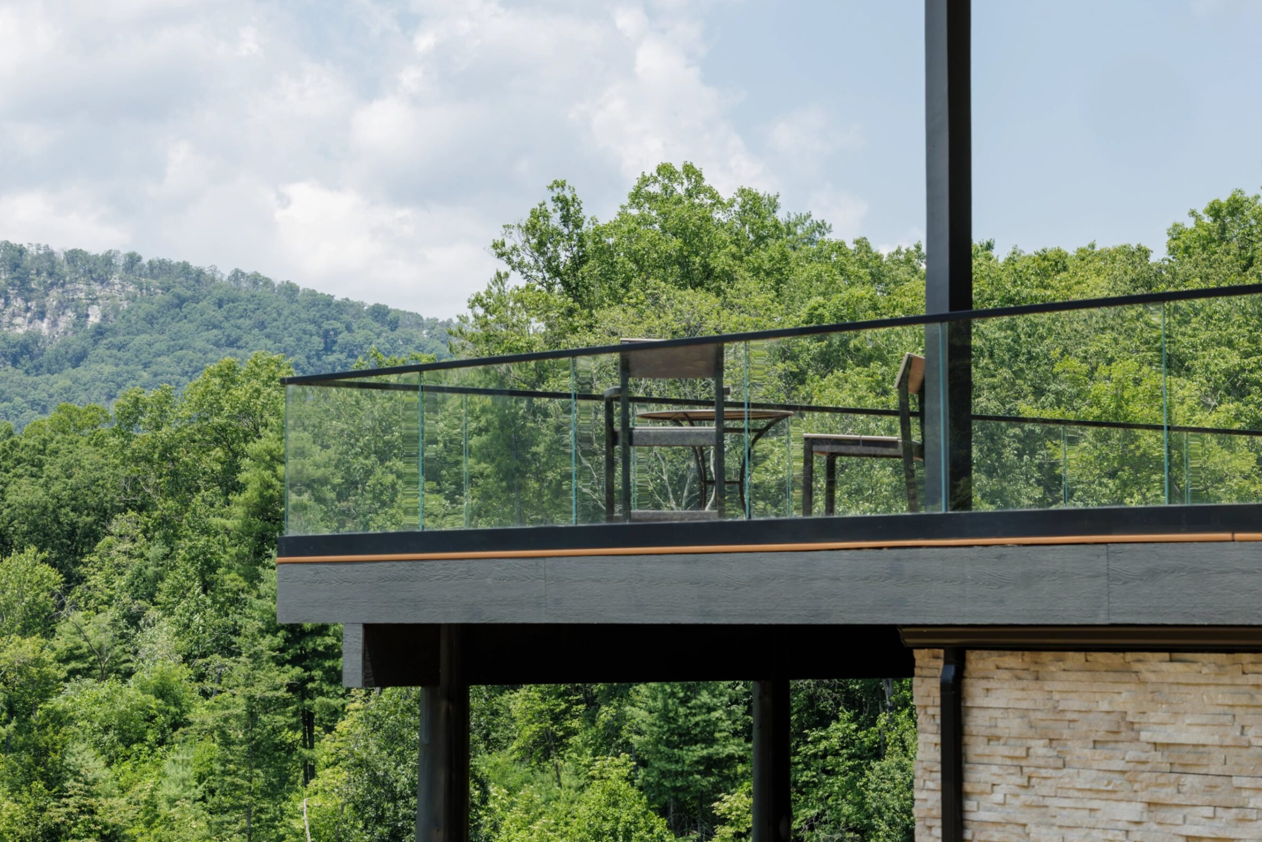 Viewrail Base Rail Glass Railing is seen on a large, modern deck.