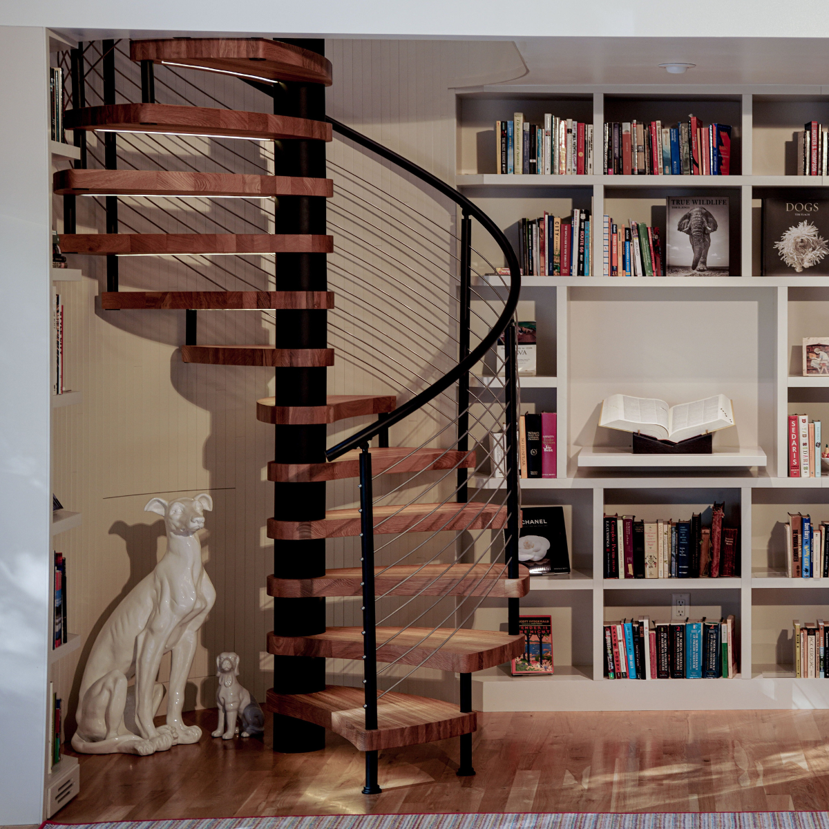 Interior FLIGHT Spiral with stainless steel rod infill and glass balcony.
