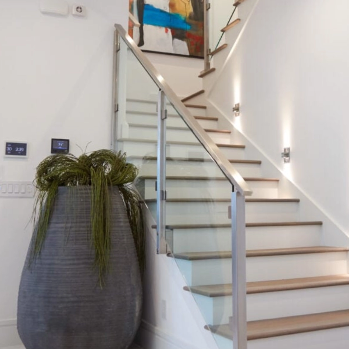 Side Mount Posts glass system on a traditional stairway.