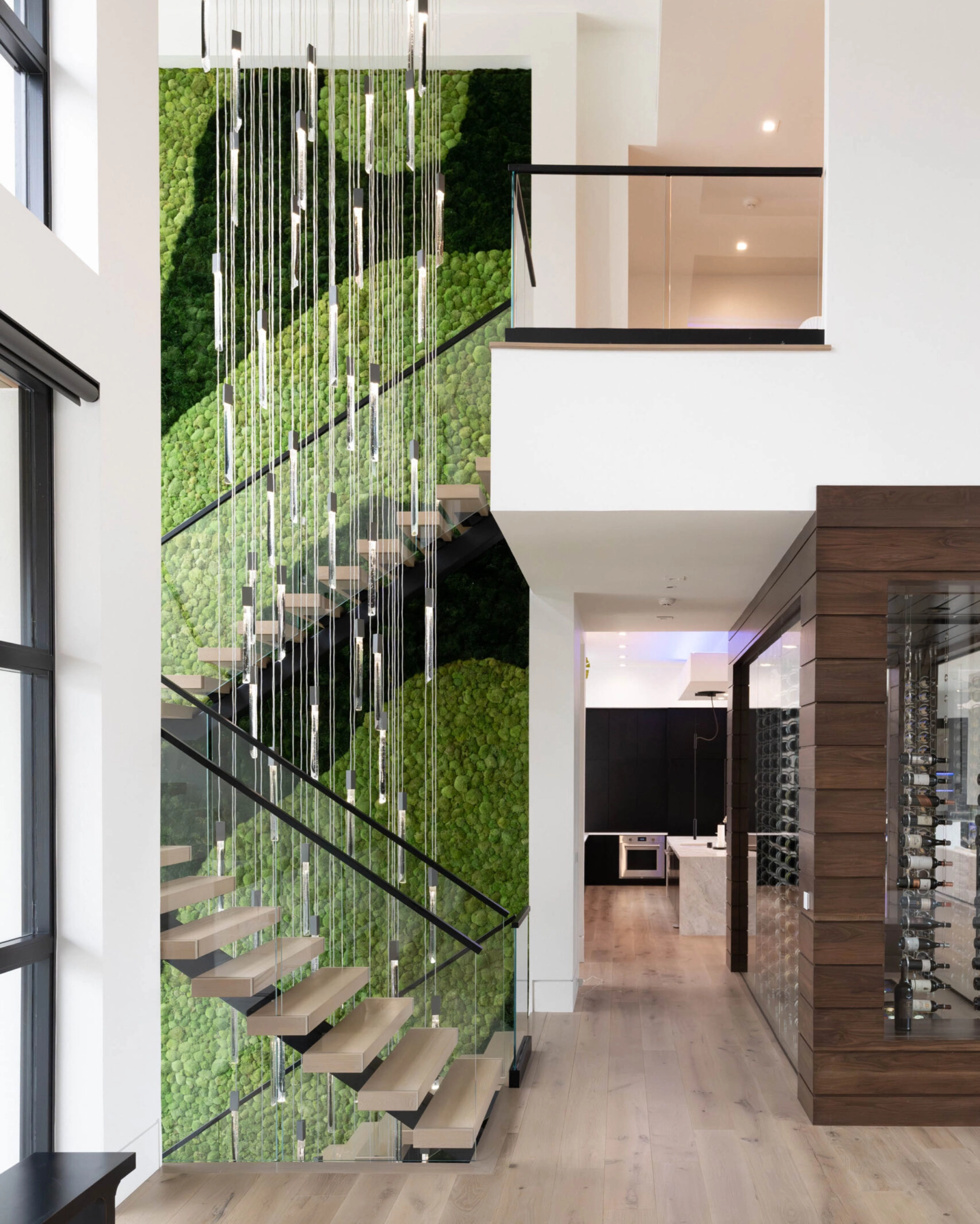 Vedera glass railing with FLIGHT Mono stairs and balcony using a Base Rail glass system.