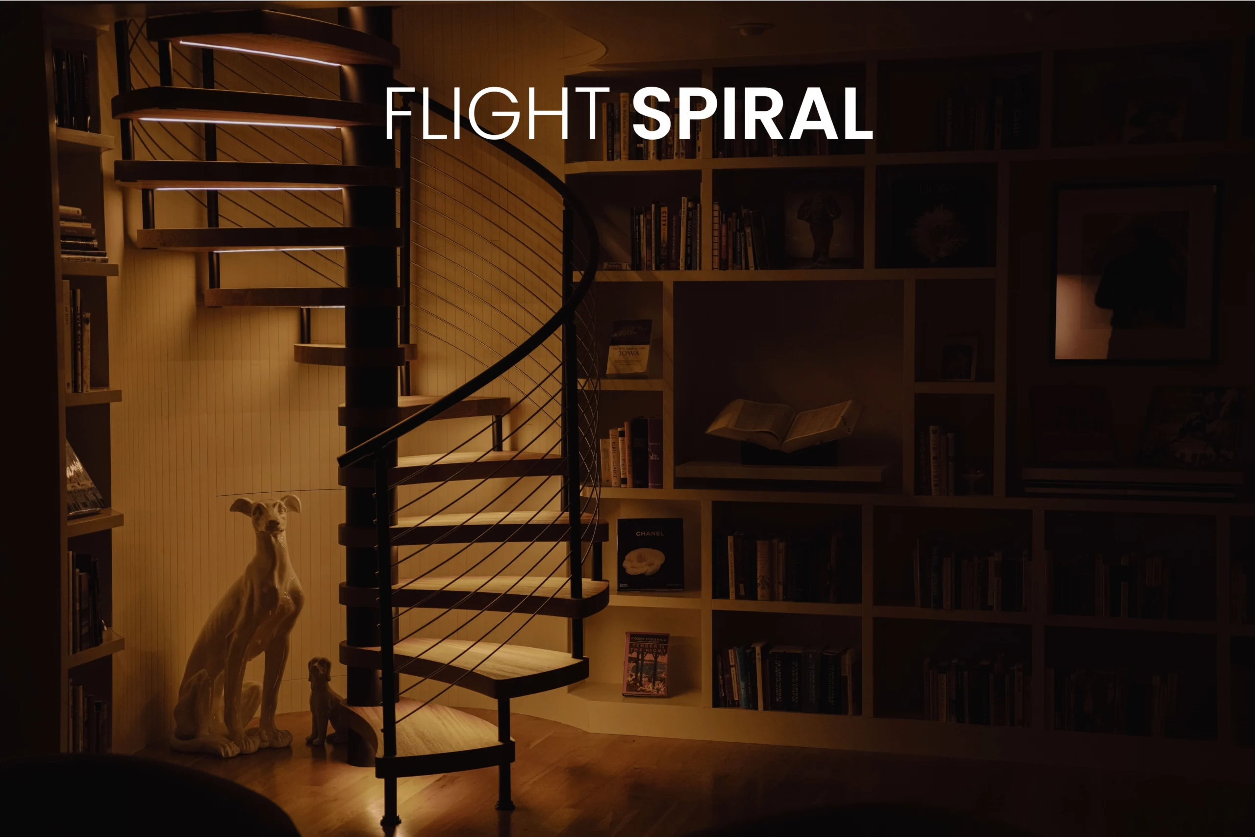 Interior FLIGHT Spiral in a dark living room with LED treads on.